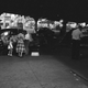 Pedestrians and vendors are pictured at the intersection of Myrtle Avenue and Broadway in Brooklyn, N.Y. Sept. 2, 1949. (AP Photo/Ed Ford)